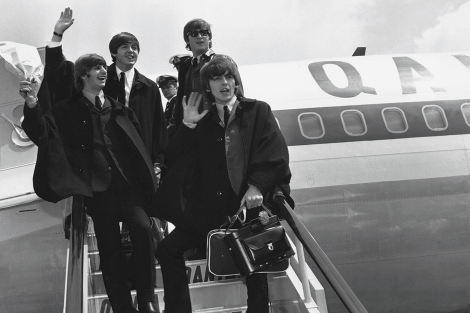 392279 07: (FILE PHOTO) The Beatles (L to R) Ringo Starr, Paul McCartney, John Lennon and George Harrison wave to fans July 2, 1964 as they return to London from a tour of Australia. It was reported November 8, 2001 that Harrison is undergoing cancer treatment in a Staten Island, NY hospital. The 58-year-old ex-Beatle was diagnosed with lung cancer and a brain tumor earlier this year. (Photo by Getty Images)